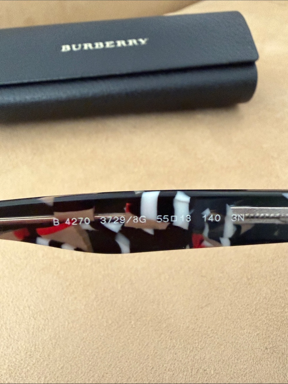 Burberry Black Cat-Eye Sunglasses with Signature Plaid Accent - Picture 3 of 4